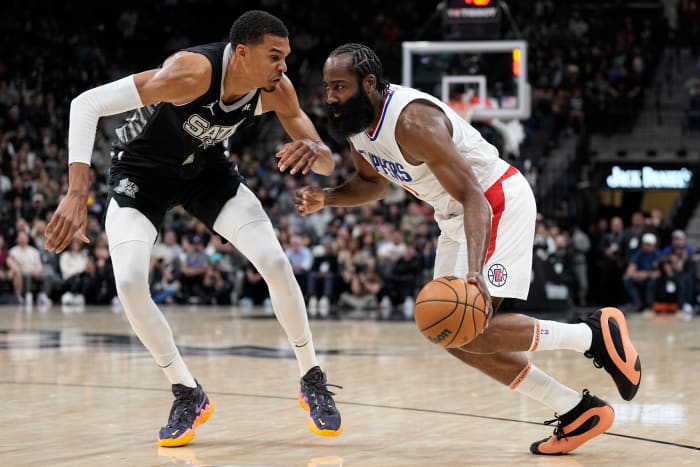 Los Angeles Clippers guard James Harden (1) drives to the basket against San Antonio Spurs forward Victor Wembanyama (1) during the first half at Frost Bank Center.
